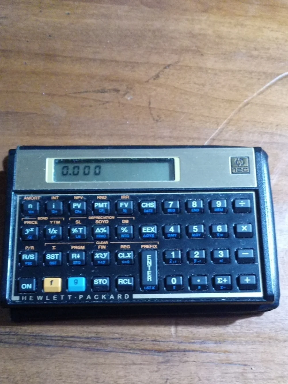 HP 12C Financial Calculator in Black and Gold Trim